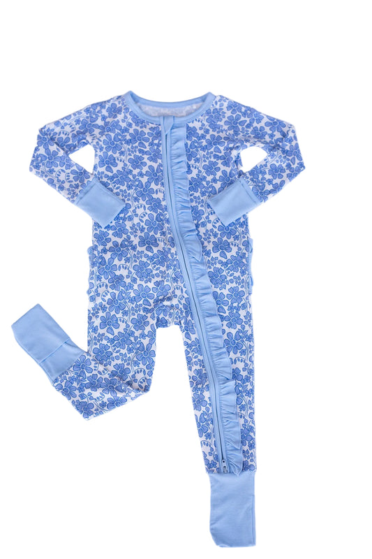 Blue floral baby onesie with legs on a light blue background
