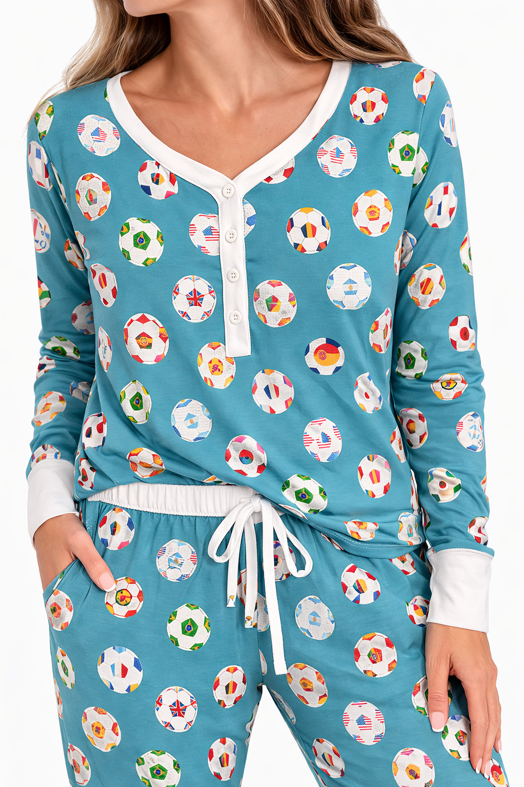 Woman wearing a blue pajama set with colorful flower pattern