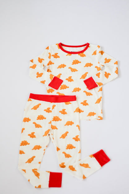 Children's pajama set with dinosaur pattern on a white background