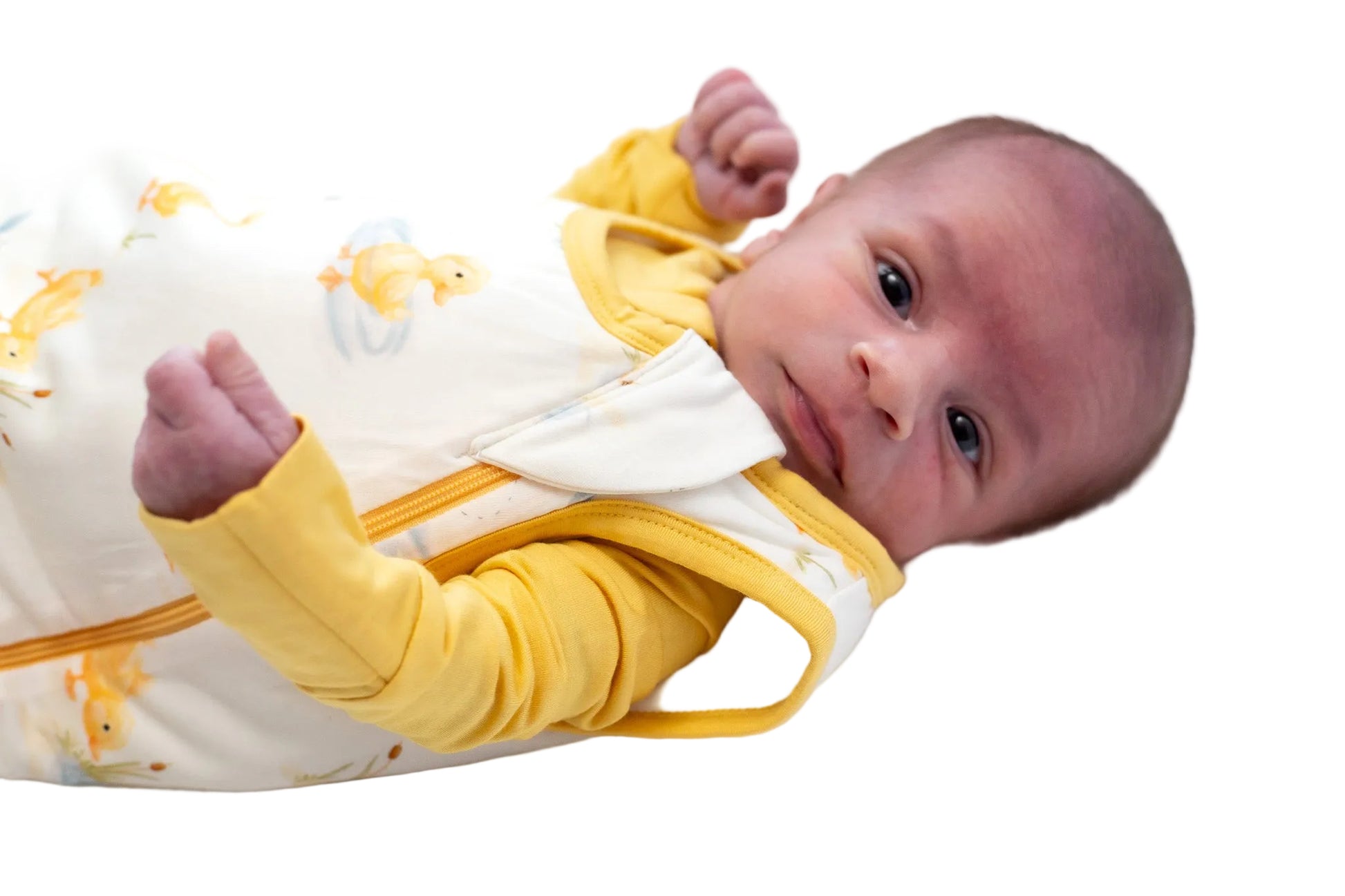 Newborn baby wearing a yellow and white bamboo sleep sack  on a white background