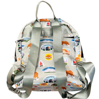 Backpack with camping-themed design on a white background