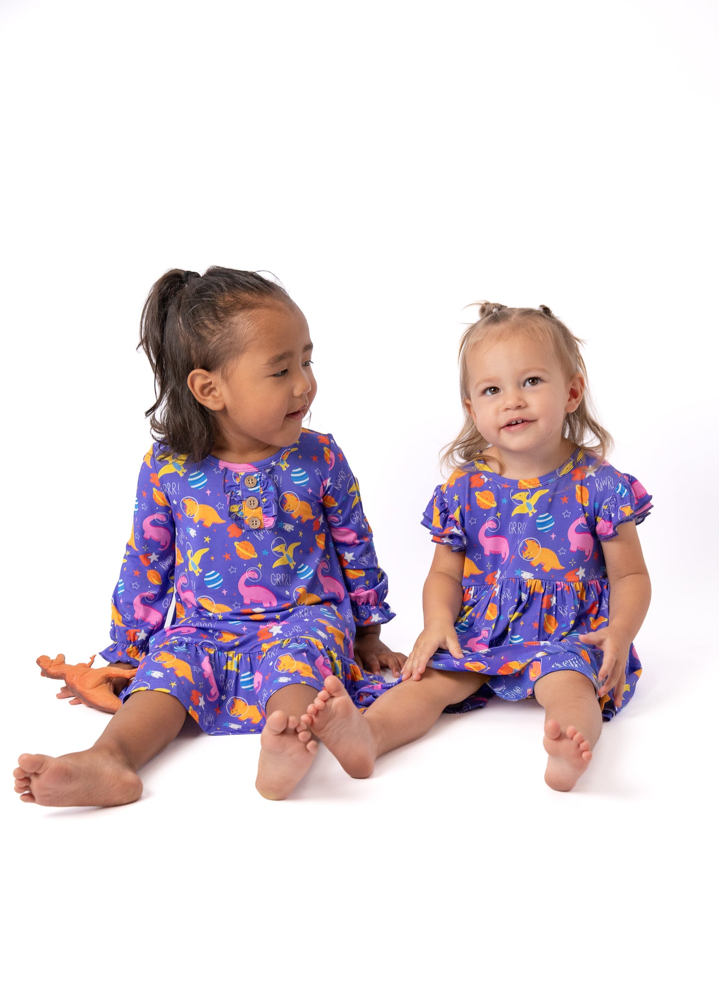 bamboo night gown and dress in dinosaur print in the color purple for little girls