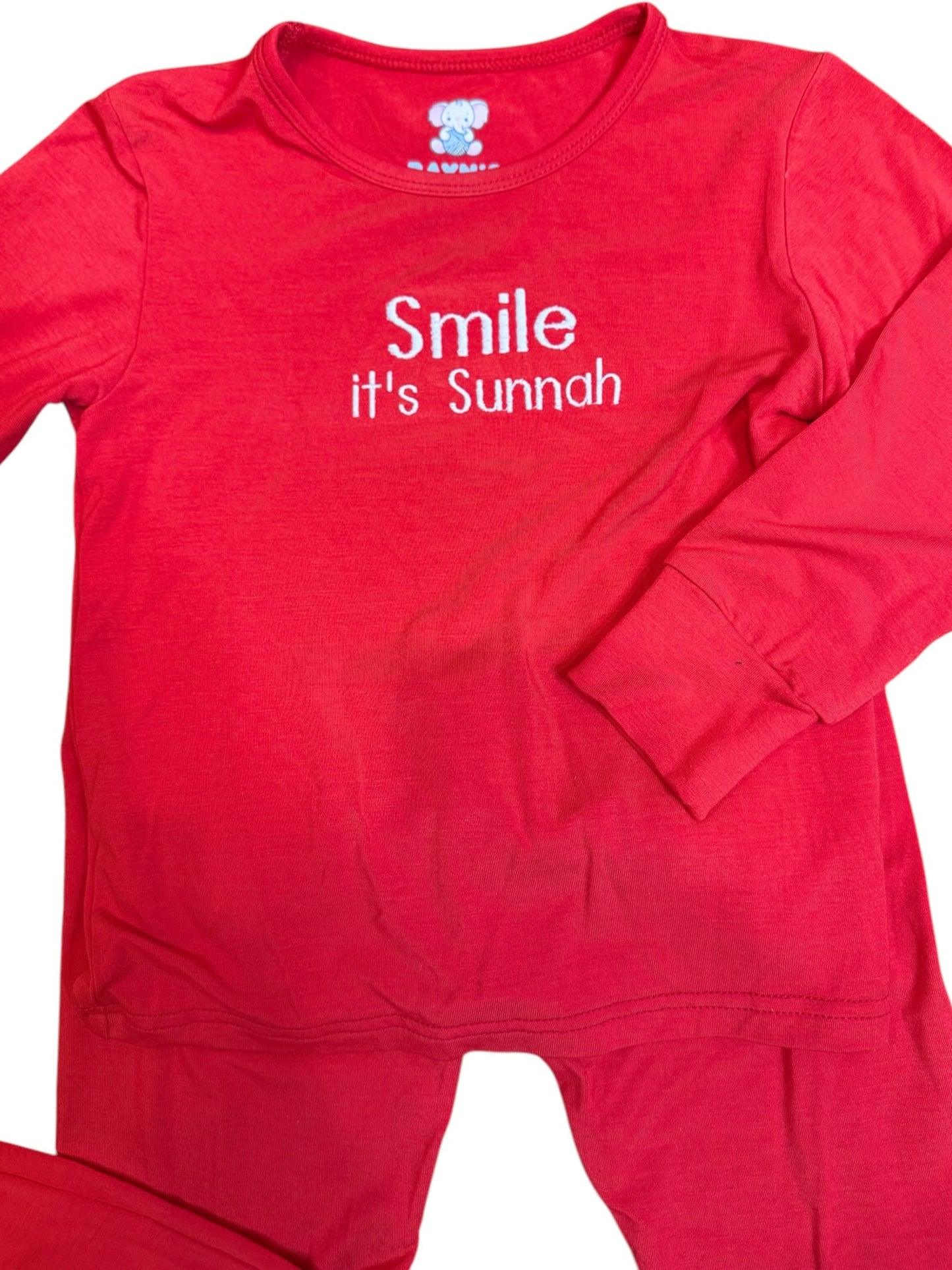 Red children's outfit with 'Smile it's Sunnah' text on a white background