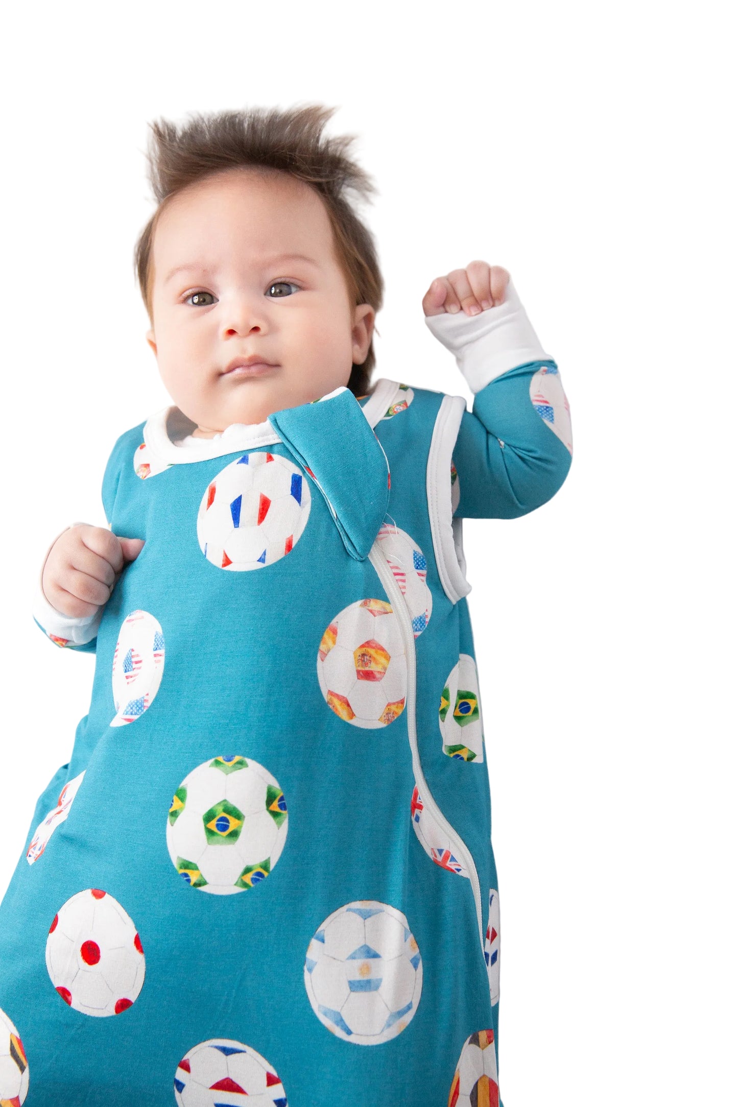 Baby wearing a colorful patterned onesie on a white background
