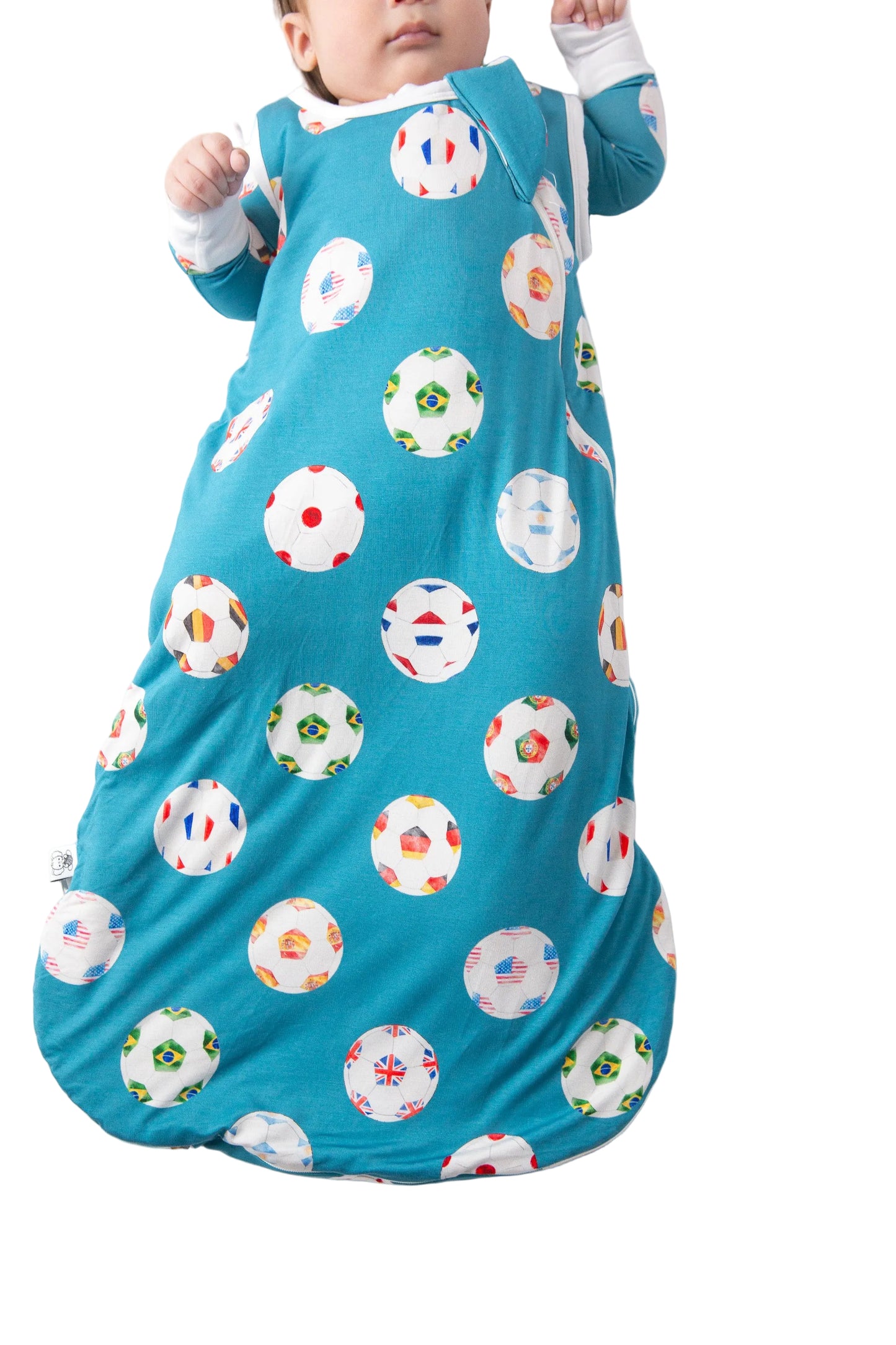 Baby in a blue睡眠袋 with colorful donut pattern on a white background