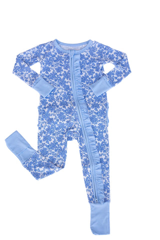 Blue floral baby onesie with legs on a light blue background