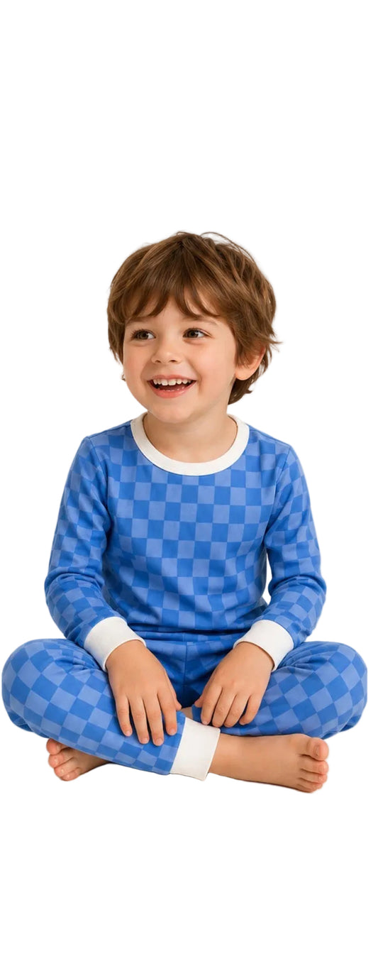 Child wearing blue checkered pajamas on a white background