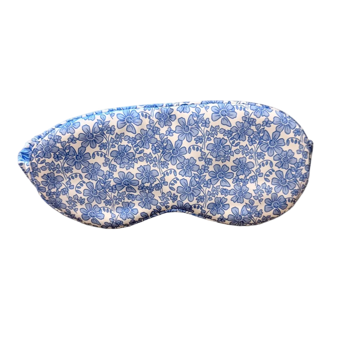 Floral patterned eye mask on a light beige background