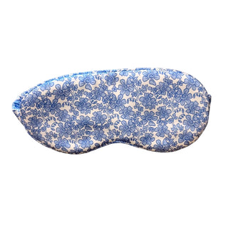 Floral patterned eye mask on a light beige background