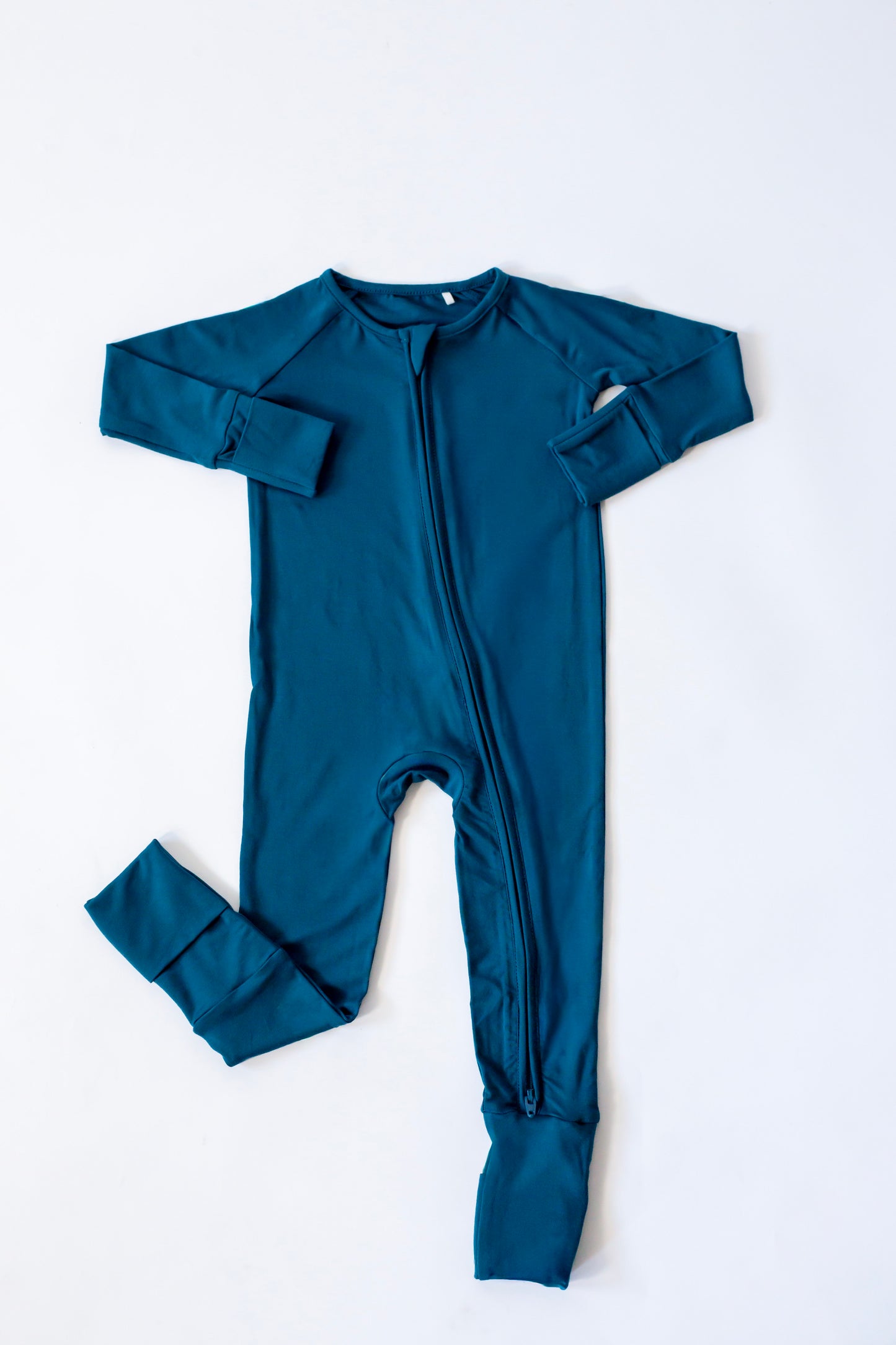 Teal baby onesie with long sleeves on a white background