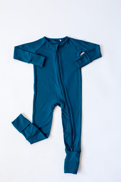 Teal baby onesie with long sleeves on a white background