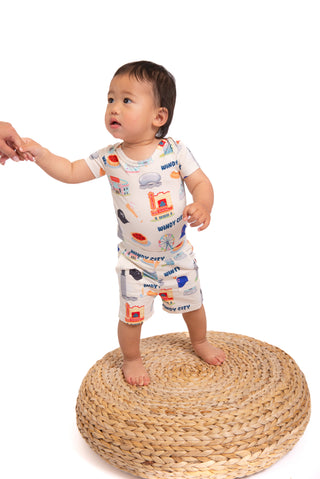 A buttery soft bamboo baby short set featuring a hidden snap bodysuit underneath for easy cuddles, secure comfort, and adorable Chicago-inspired style.