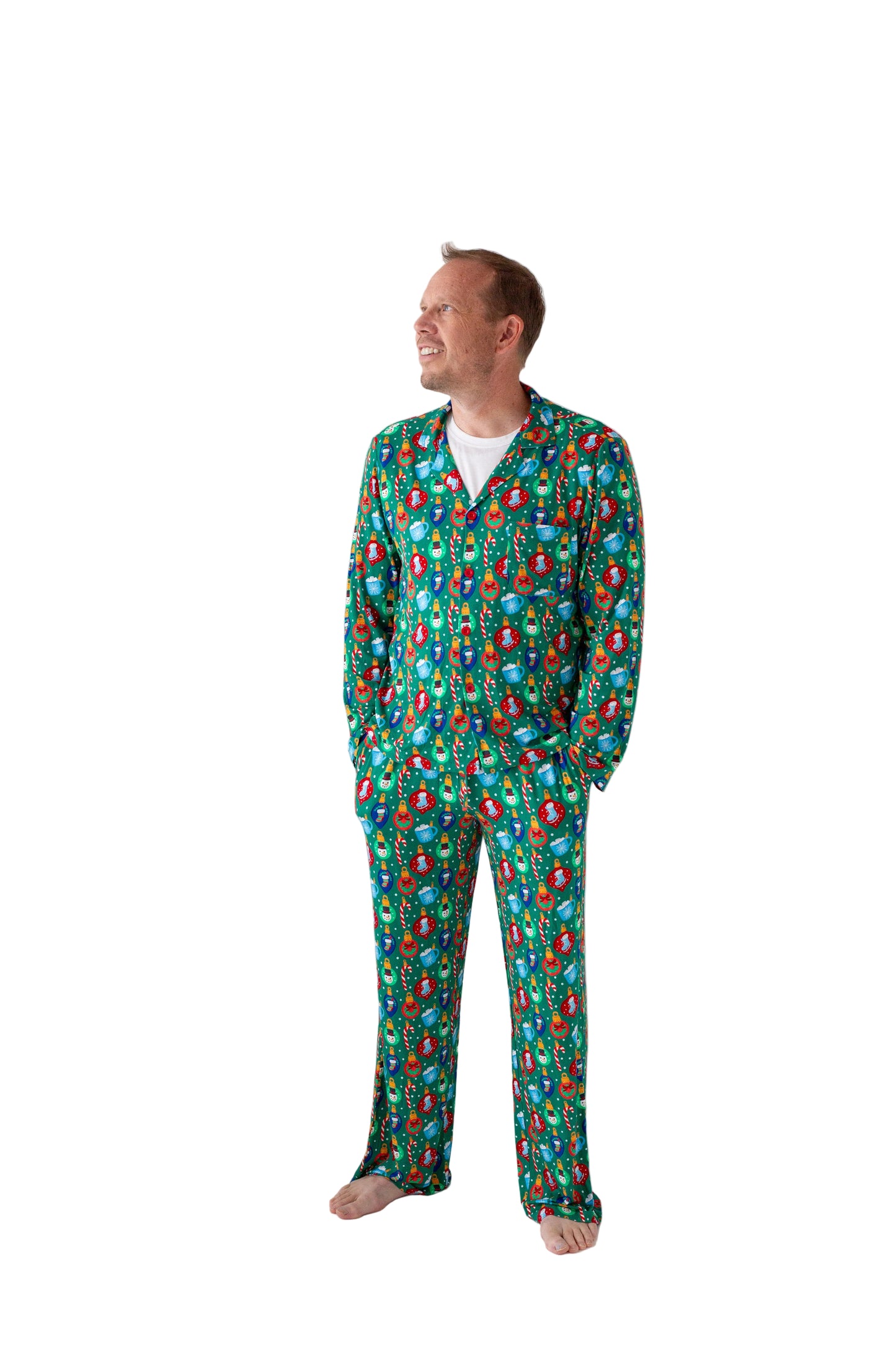 Man wearing a green floral pajama set against a white background