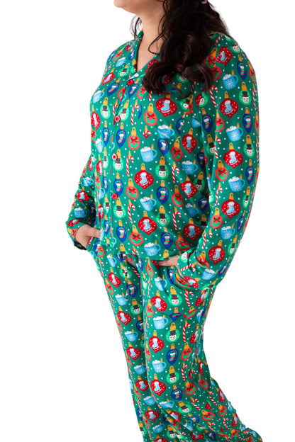 Person wearing a festive onesie with Christmas-themed decorations on a white background