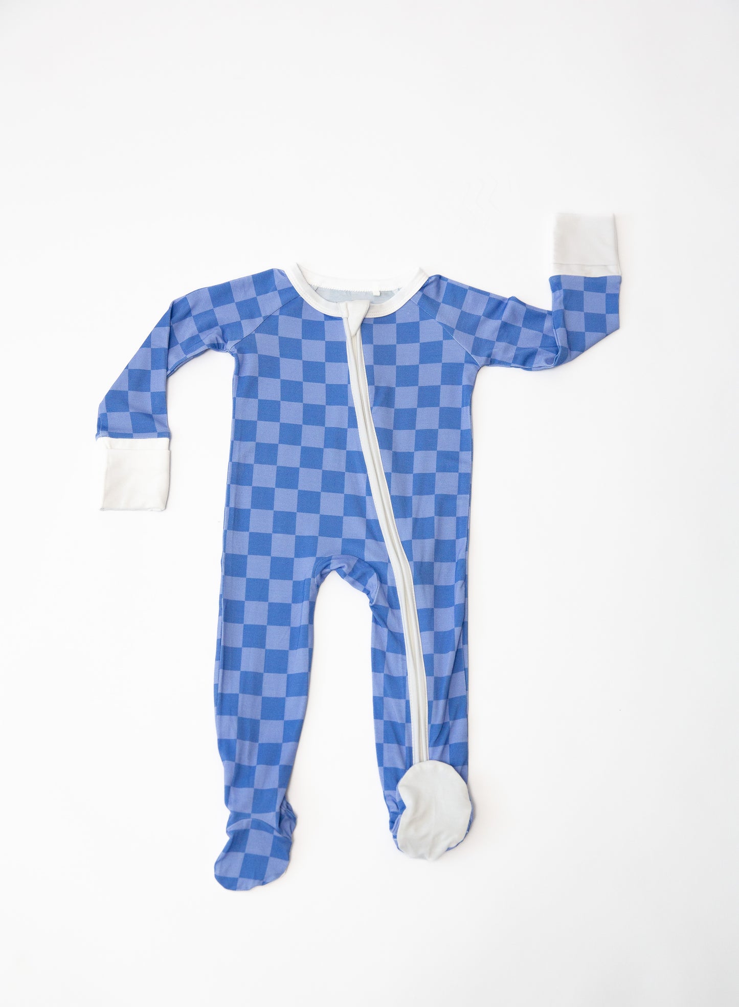 Blue checkered baby onesie with white zipper on a white background