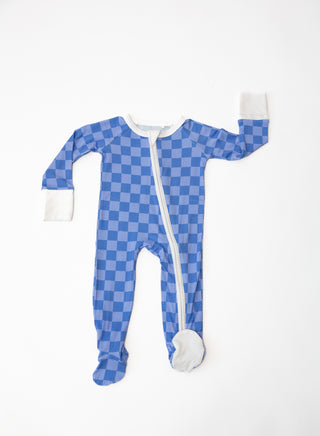 Blue checkered baby onesie with white zipper on a white background