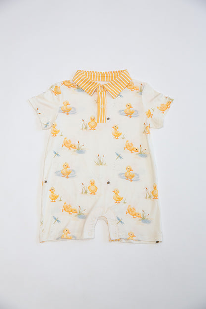 Baby romper with duck pattern on a white background