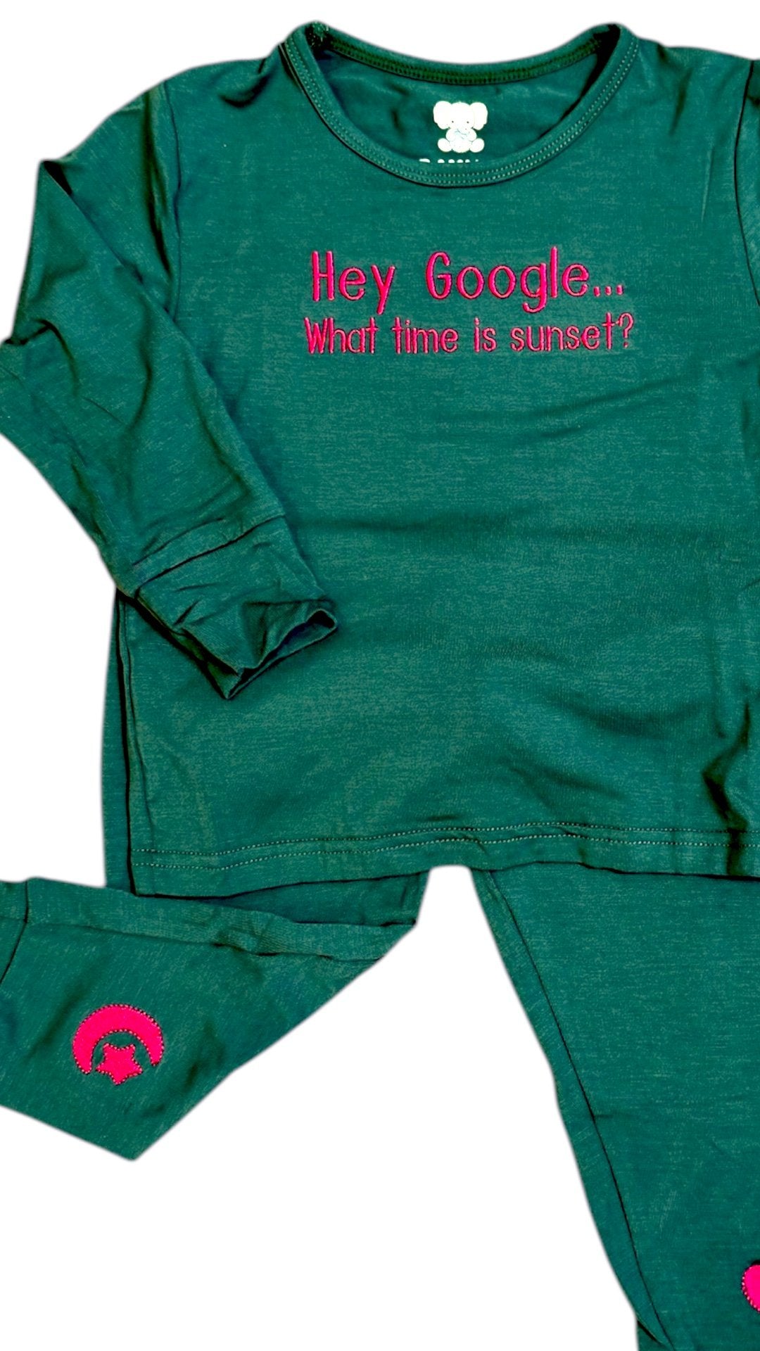 Green pajama set with pink text on a white background