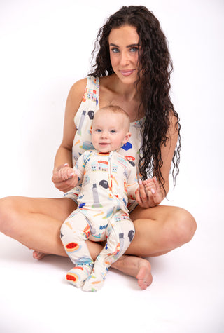 Woman wearing Windy City Chicago bamboo tank and drawstring shorts pajama set featuring skyline and Navy Pier inspired artwork