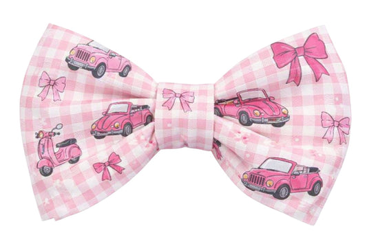 Pink checkered bow tie with vintage car and scooter designs on a white background