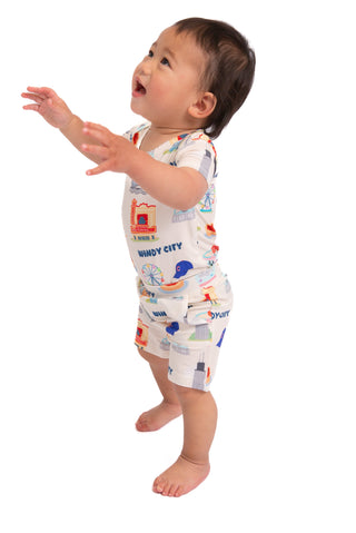 Baby wearing My First Windy City bamboo short set with hidden snap bodysuit, Chicago skyline artwork, and matching shorts