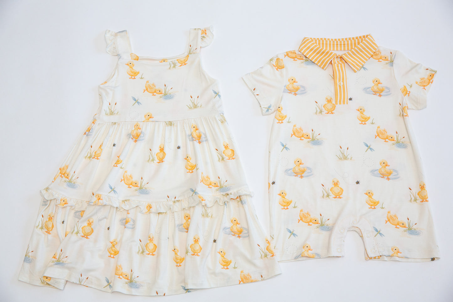 Two children's outfits with animal patterns on a white background