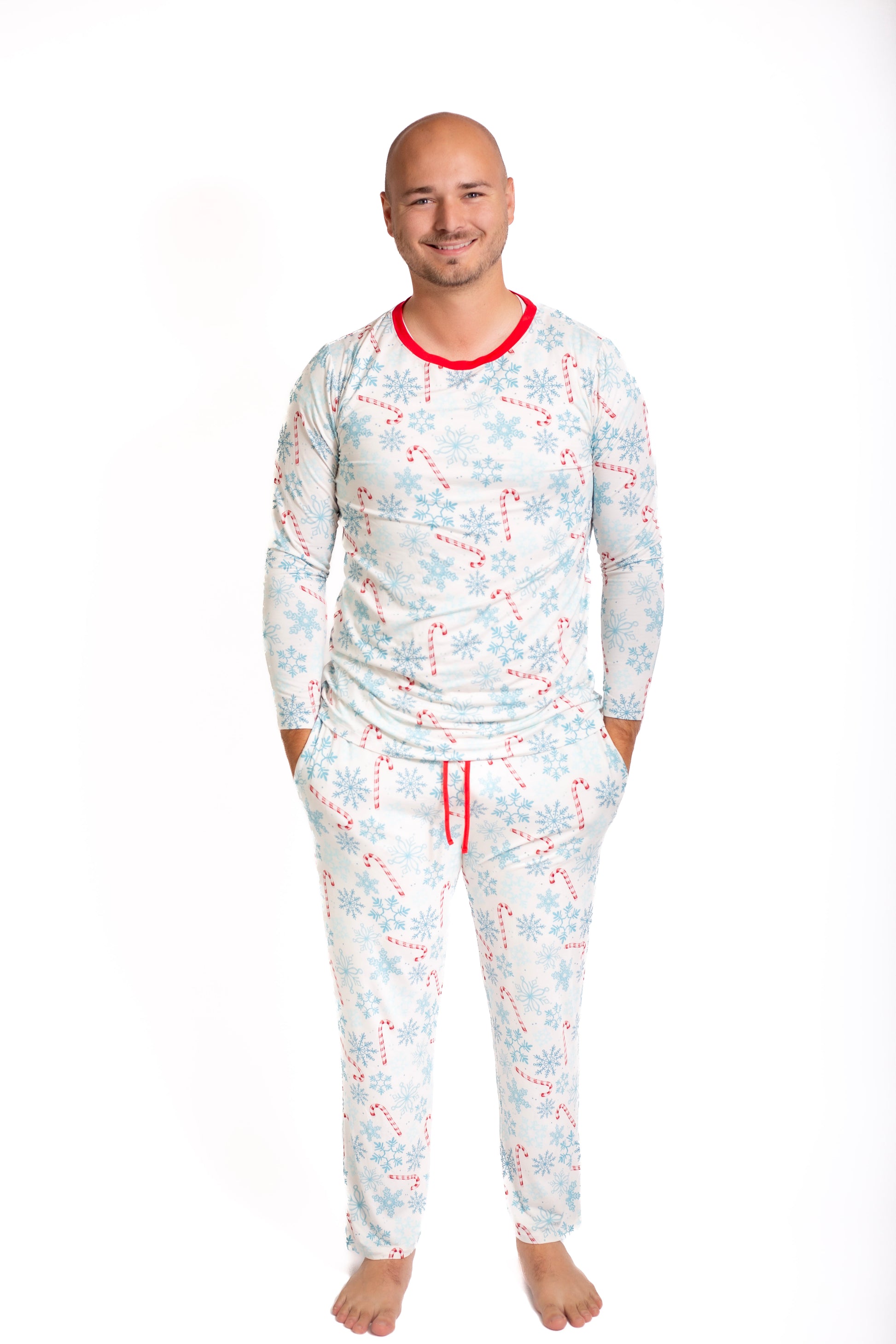 Man wearing a patterned pajama set on a white background