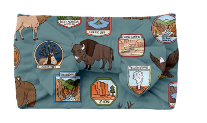 Fleece blanket with nature-themed designs on a blue background