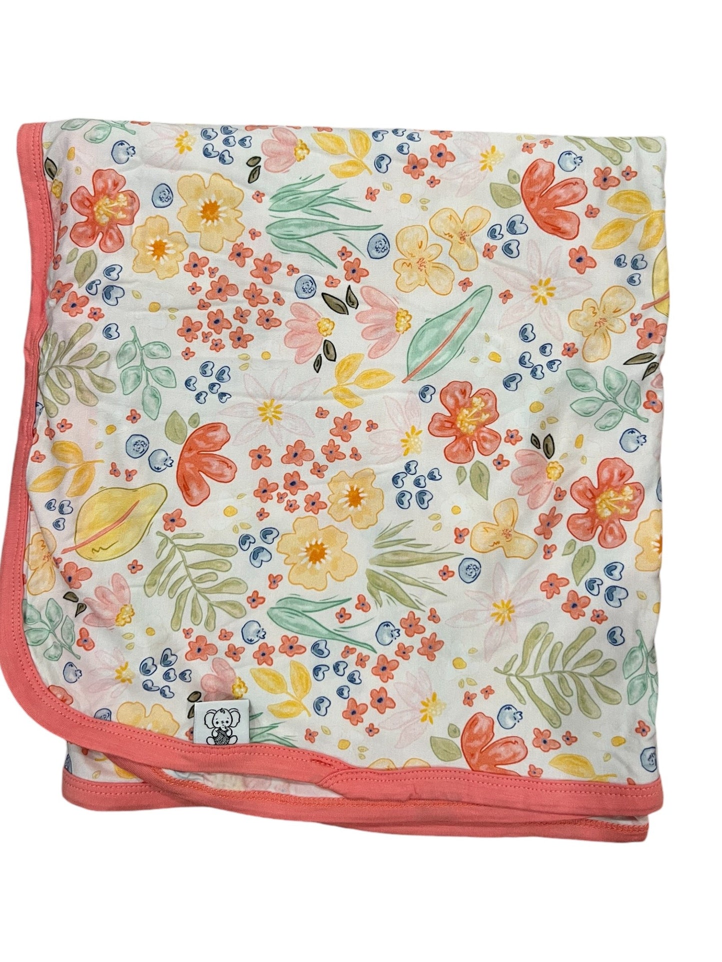 Floral patterned blanket with a pink border on a white background