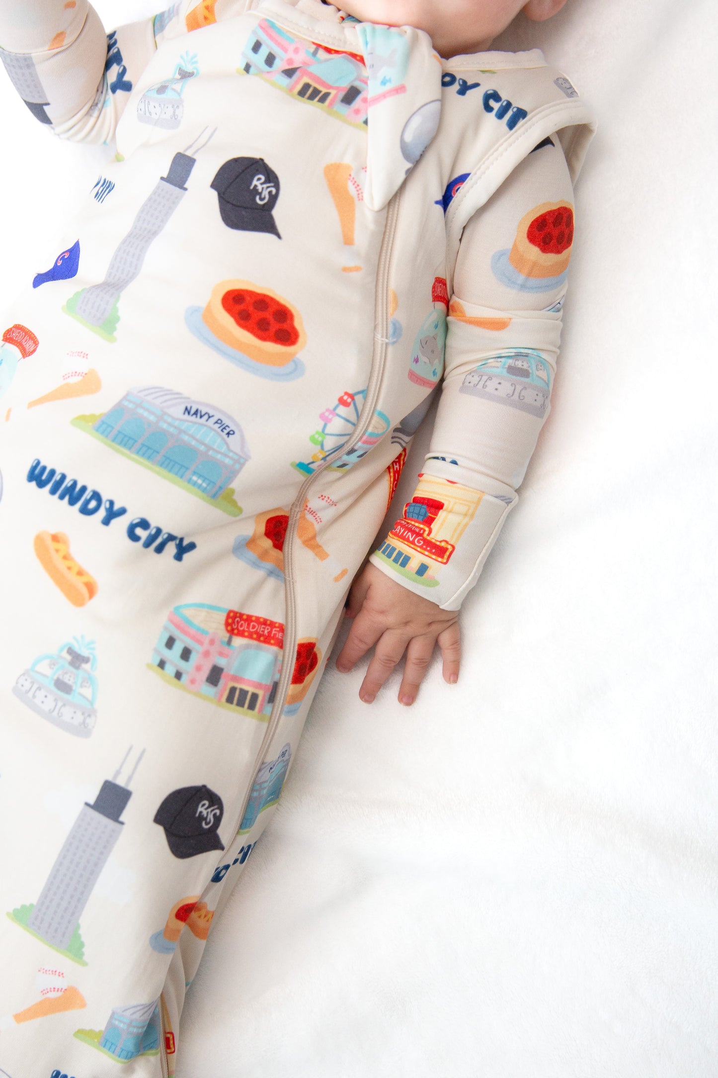 Baby wearing My First Windy City bamboo sleep sack with double zipper, neck protection, and Chicago-inspired limited edition artwork