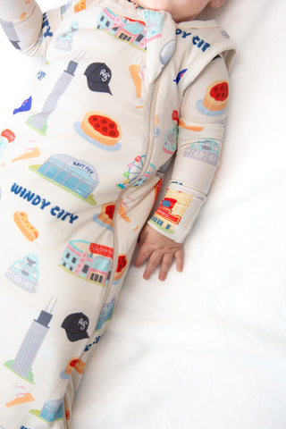 Baby wearing My First Windy City bamboo sleep sack with double zipper, neck protection, and Chicago-inspired limited edition artwork