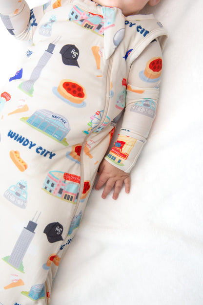 Baby wearing My First Windy City bamboo sleep sack with double zipper, neck protection, and Chicago-inspired limited edition artwork