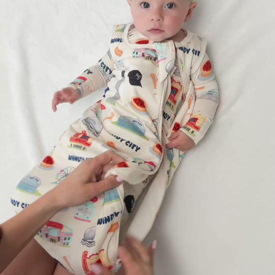 A buttery soft limited edition bamboo sleep sack featuring temperature-regulating fabric, double zippers, neck protection, and cozy Chicago-inspired artwork for sensitive babies.