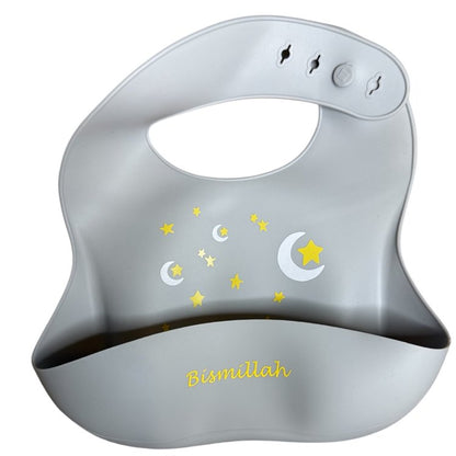 Gray baby bib with star and moon designs and 'Bismillah' text on a white background