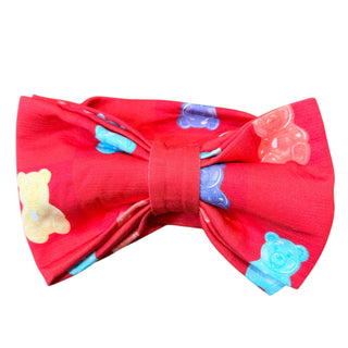 Red bow tie with teddy bear pattern on a white background