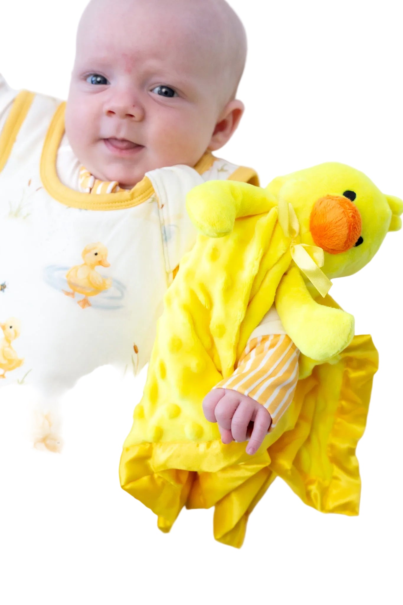 Baby wrapped in a yellow blanket with a duck toy on a white background
