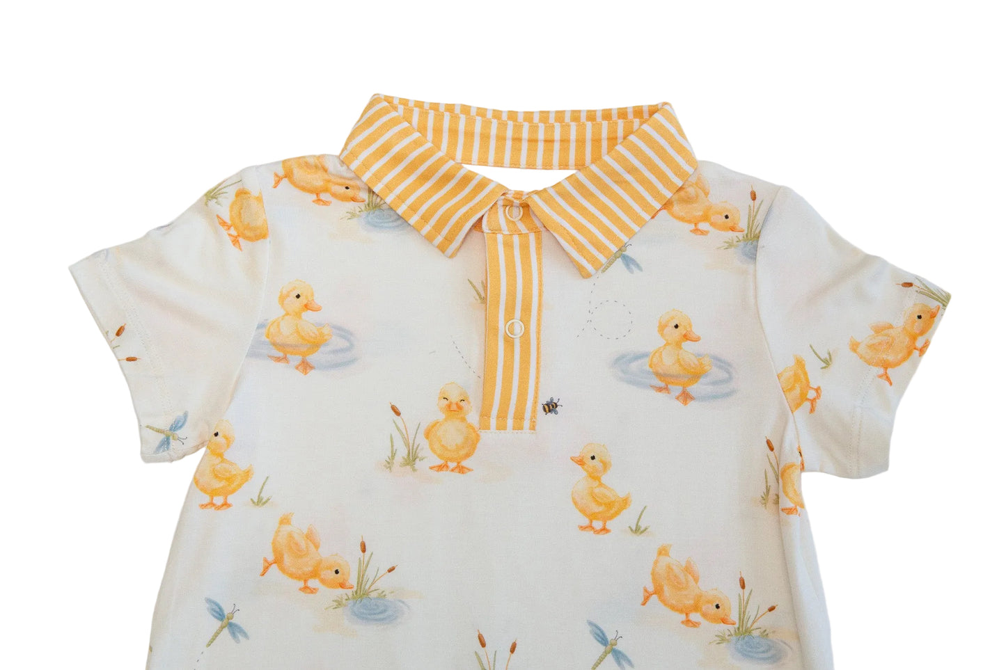 Baby dress with duck pattern and yellow striped collar on a white background