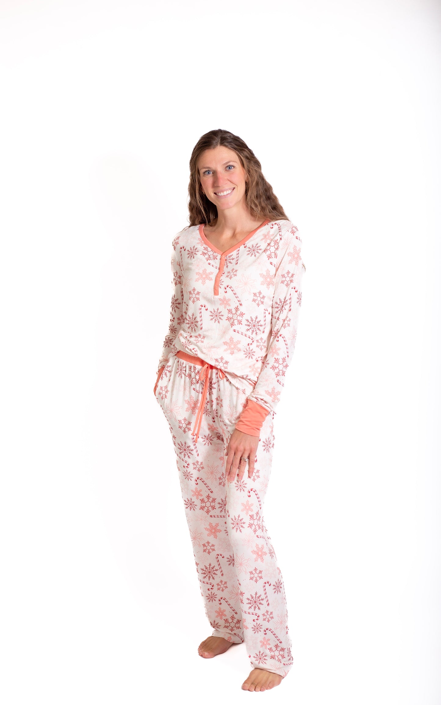 Woman wearing a floral pajama set on a white background