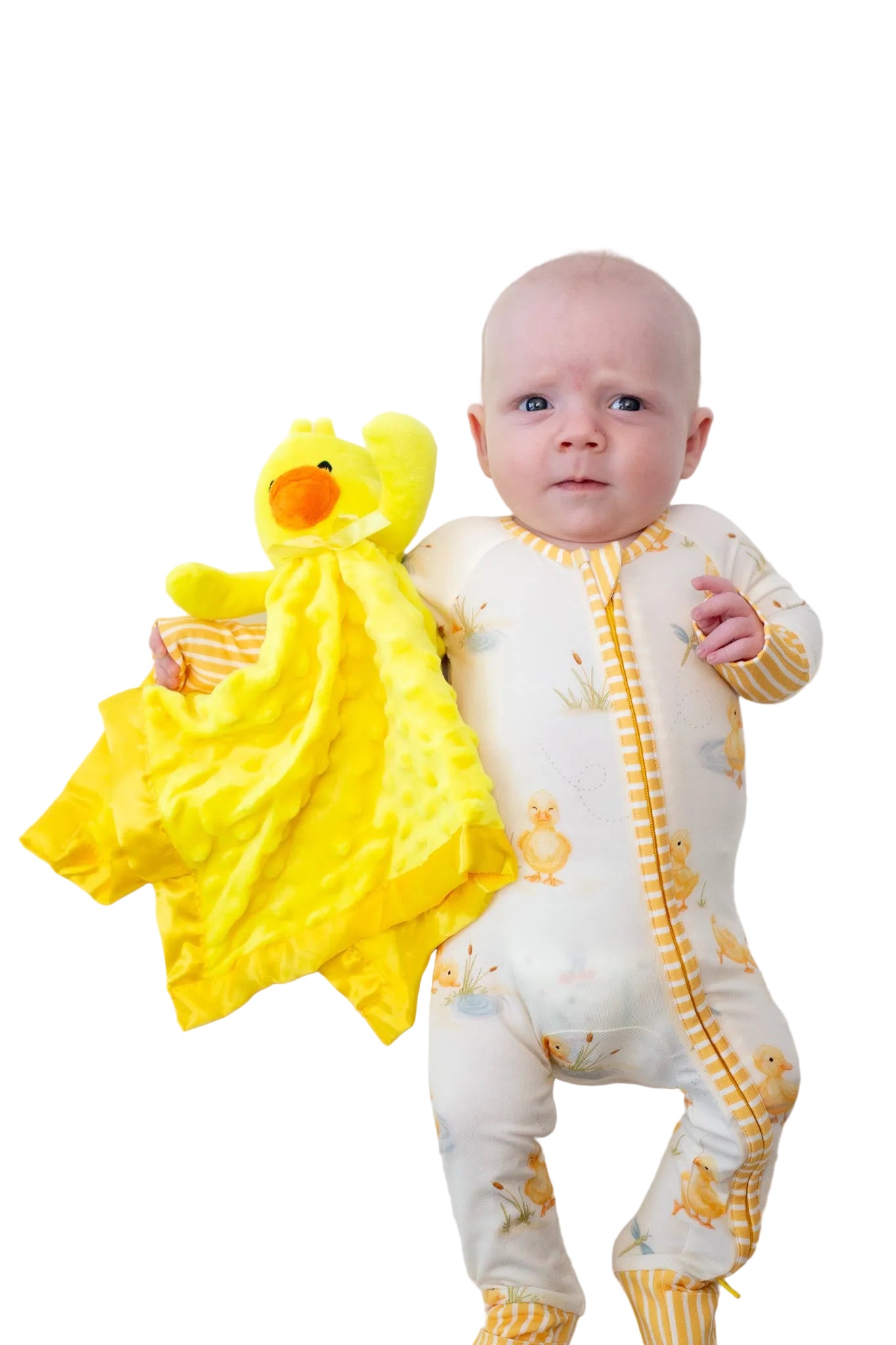 Baby in a yellow and white onesie holding a yellow duck toy on a white background